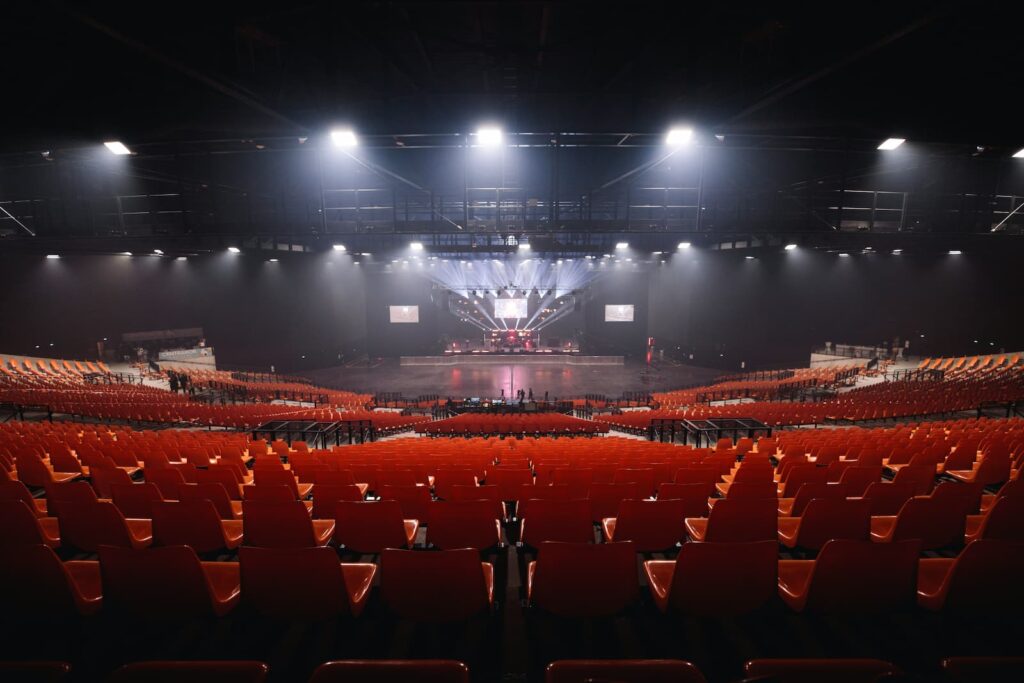 Business Advisor 1 Empty concert arena before a show, illustrating concert residency economics